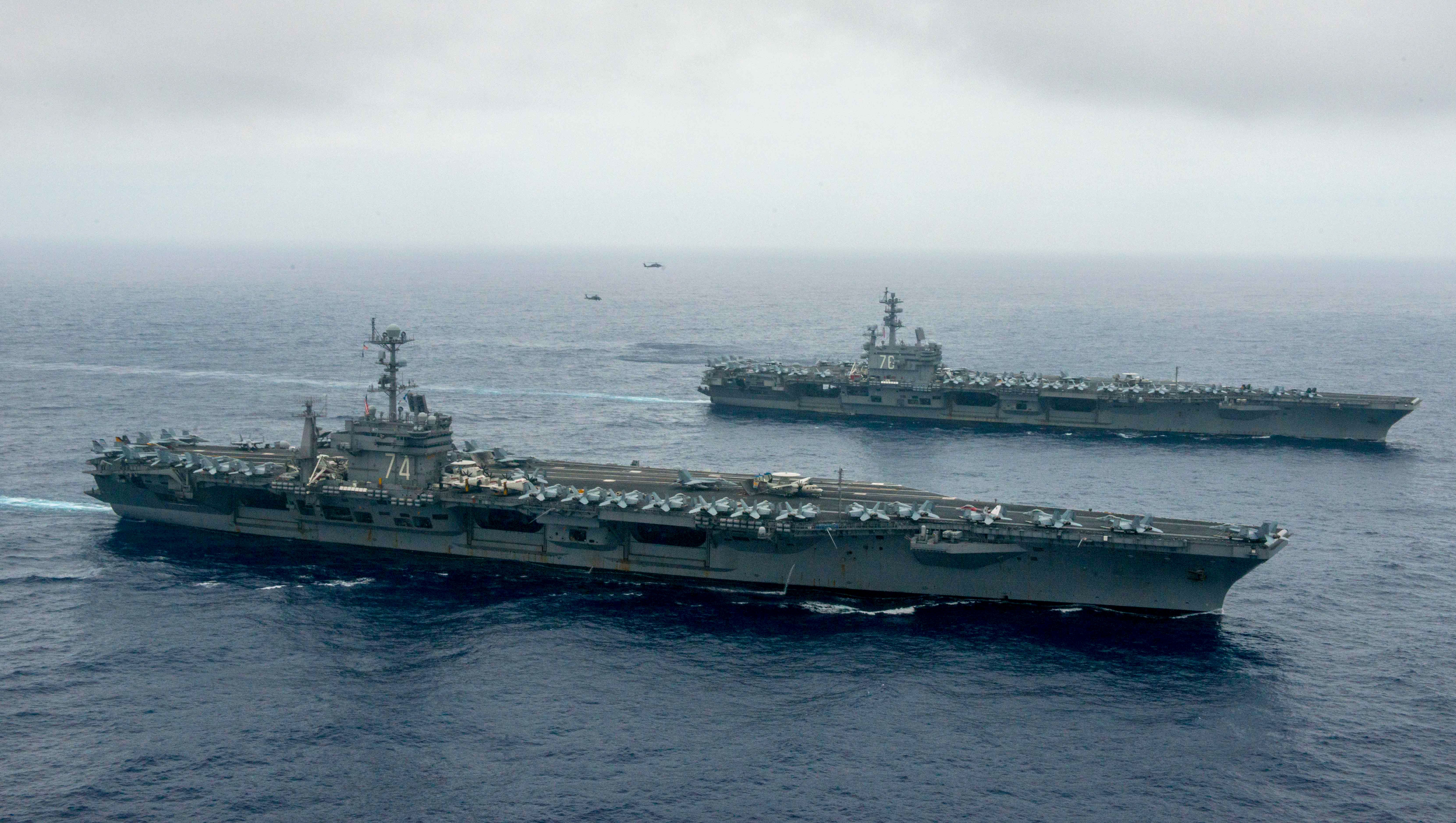 The Nimitz-class aircraft carriers USS John C. Stennis (CVN 74), center, and USS Ronald Reagan (CVN 76) conduct dual aircraft carrier strike group operations in the U.S. 7th Fleet area of operations in support of security and stability in the Indo-Asia-Pacific on June 18, 2016. US Navy photo.