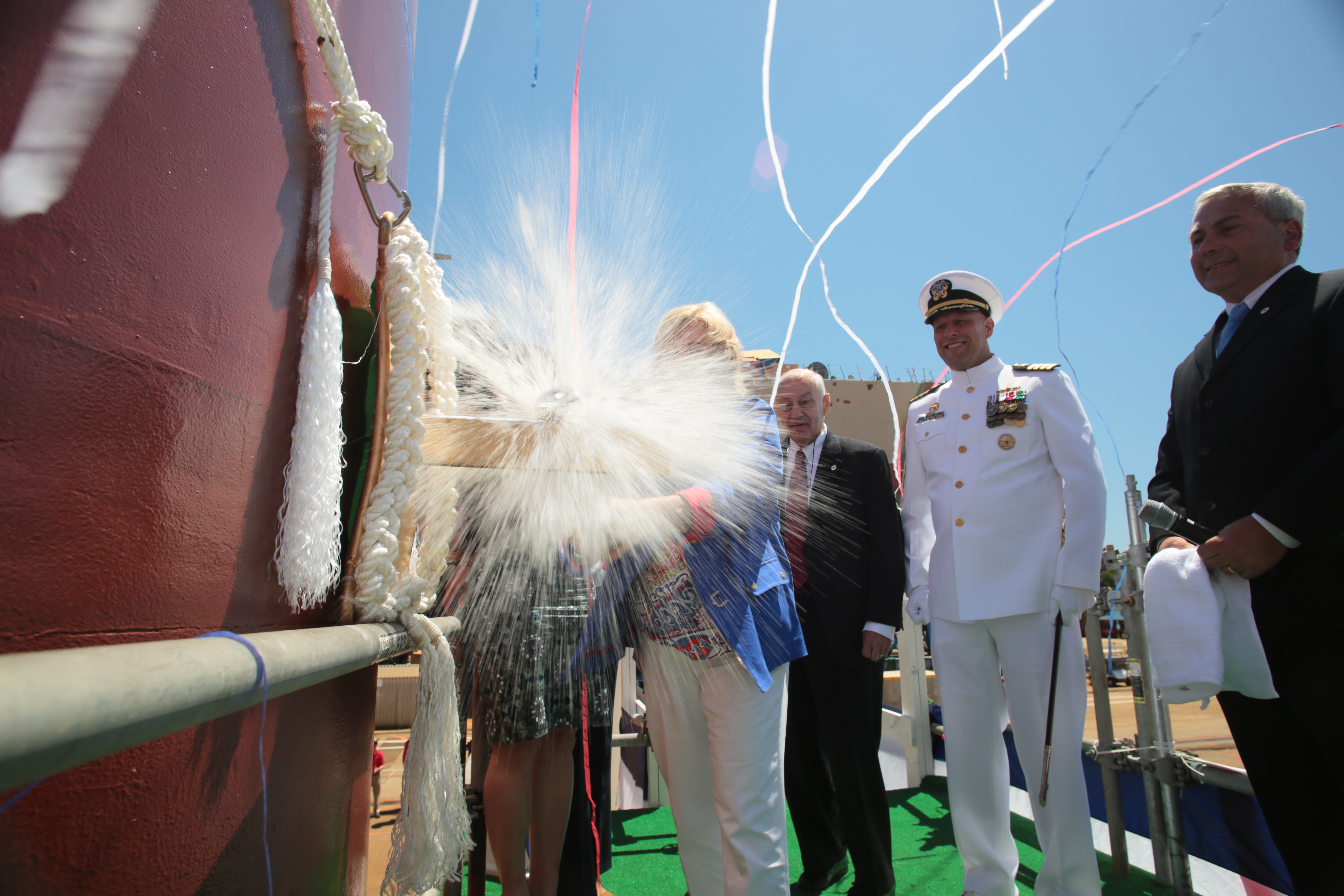 Sally Monsoor christens the future USS Michael Monsoor (DDG 1001), which is named in honor of her son, Medal of Honor recipient Navy Petty Officer 2nd Class (SEAL) Michael A. Monsoor. US Navy photo.