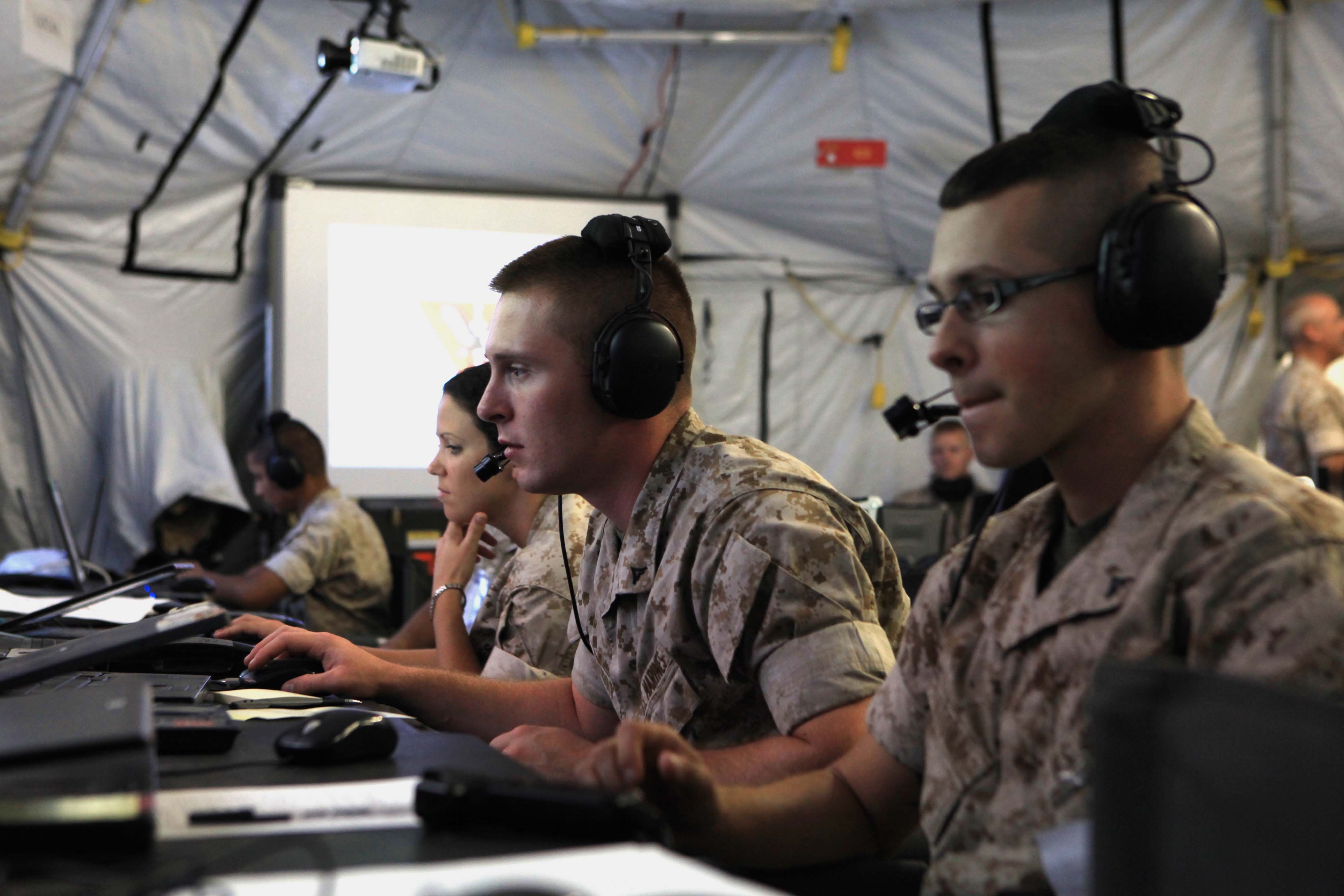 Marine tactical air command squadron 48 Marines receive aircraft and ground troop information on their monitors during Operation Javelin Thrust at Marine Corps Air Station Yuma, Ariz., July 24, 2011. US Marine Corps photo.