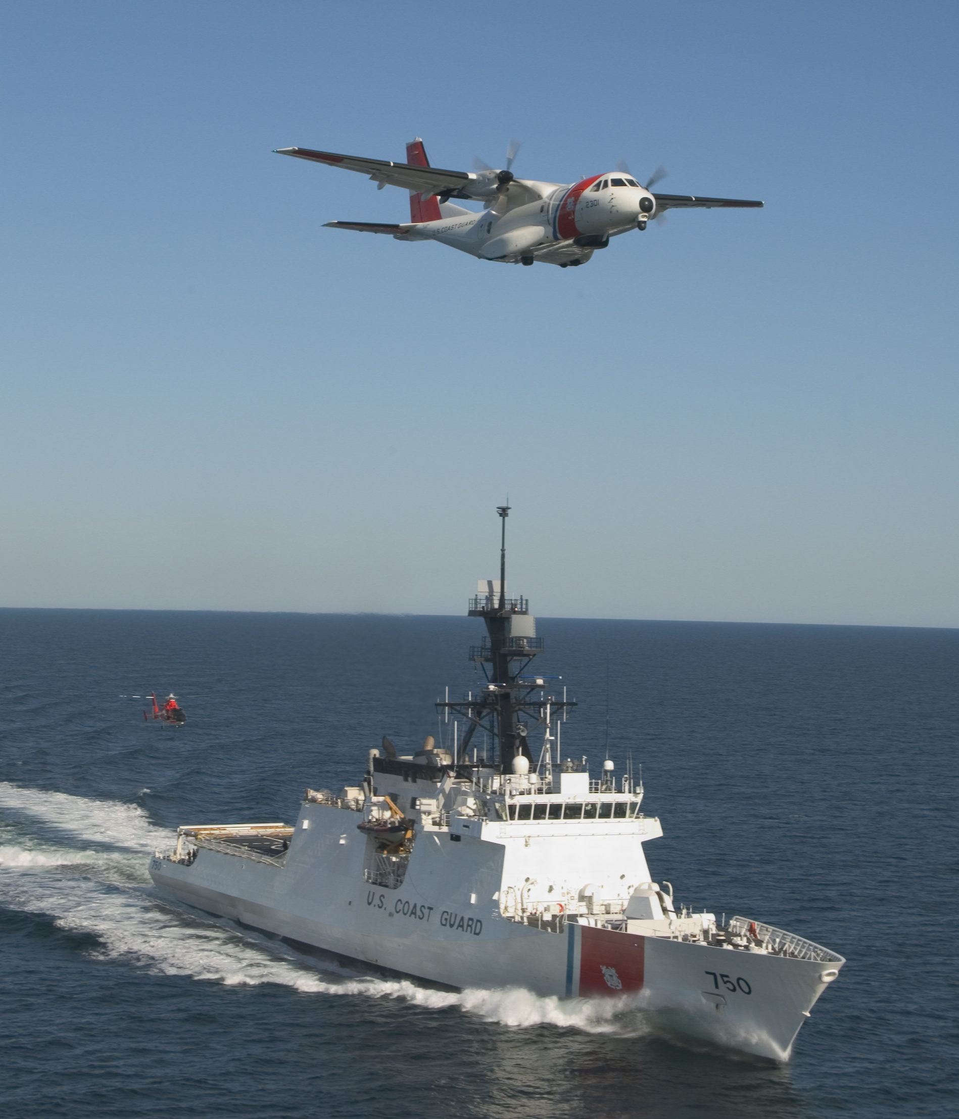 The U. S. Coast Guard's first national security cutter took to the sea on Friday, operating in concert with the service's new maritime patrol aircraft, the Ocean Sentry HC-144A, and a newly re-engined MH-65C helicopter. US Coast Guard photo.