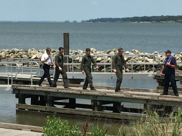 The three crew members from the MH-60S that crashed in the James River walked from the Newport News Police Department (NNPD) boat to an ambulance. NNPD photo. 