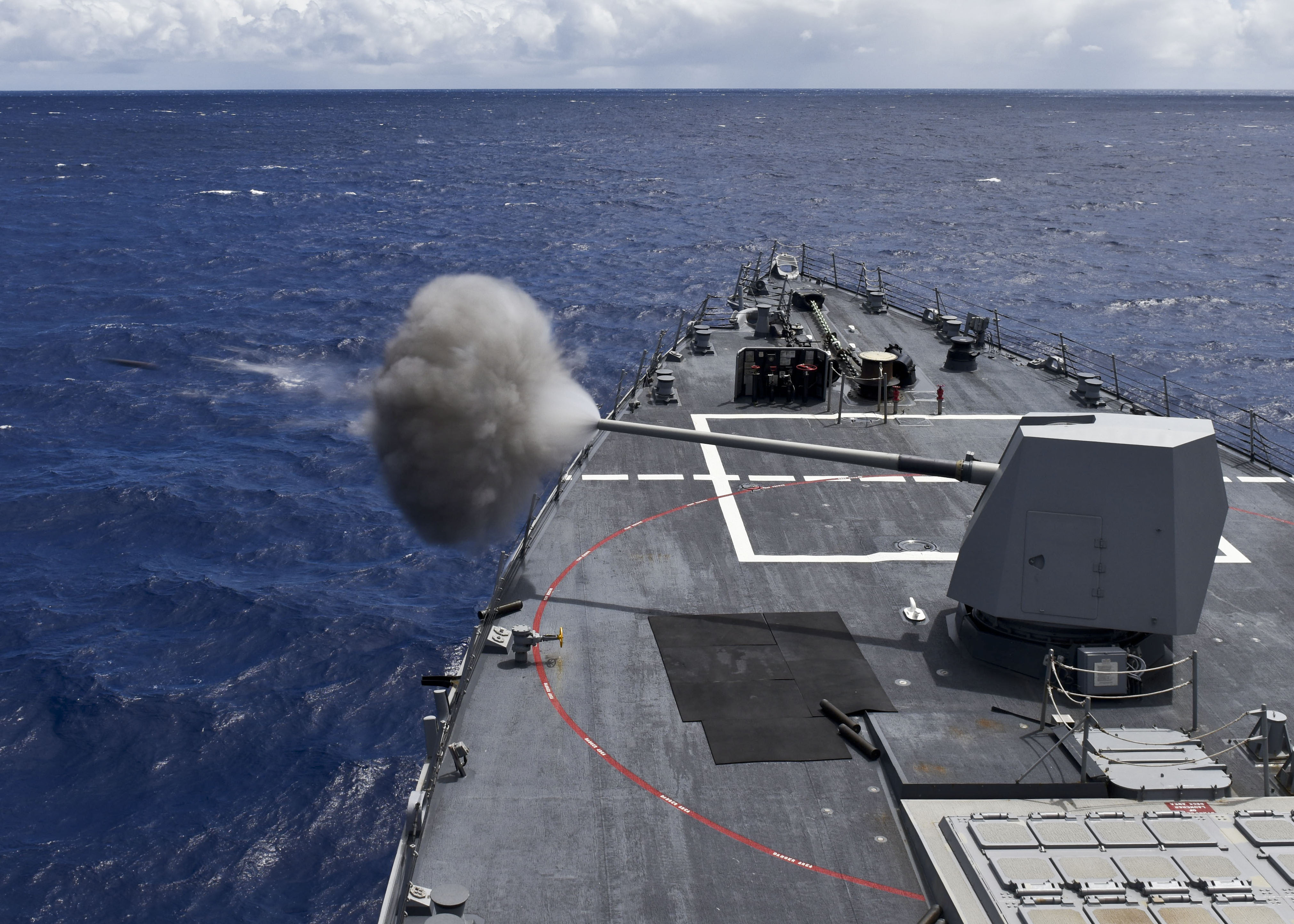 USS Shoup (DDG 86) fires a MK 45 5-inch gun during a live fire exercise during Rim of the Pacific 2016. US Navy Photo