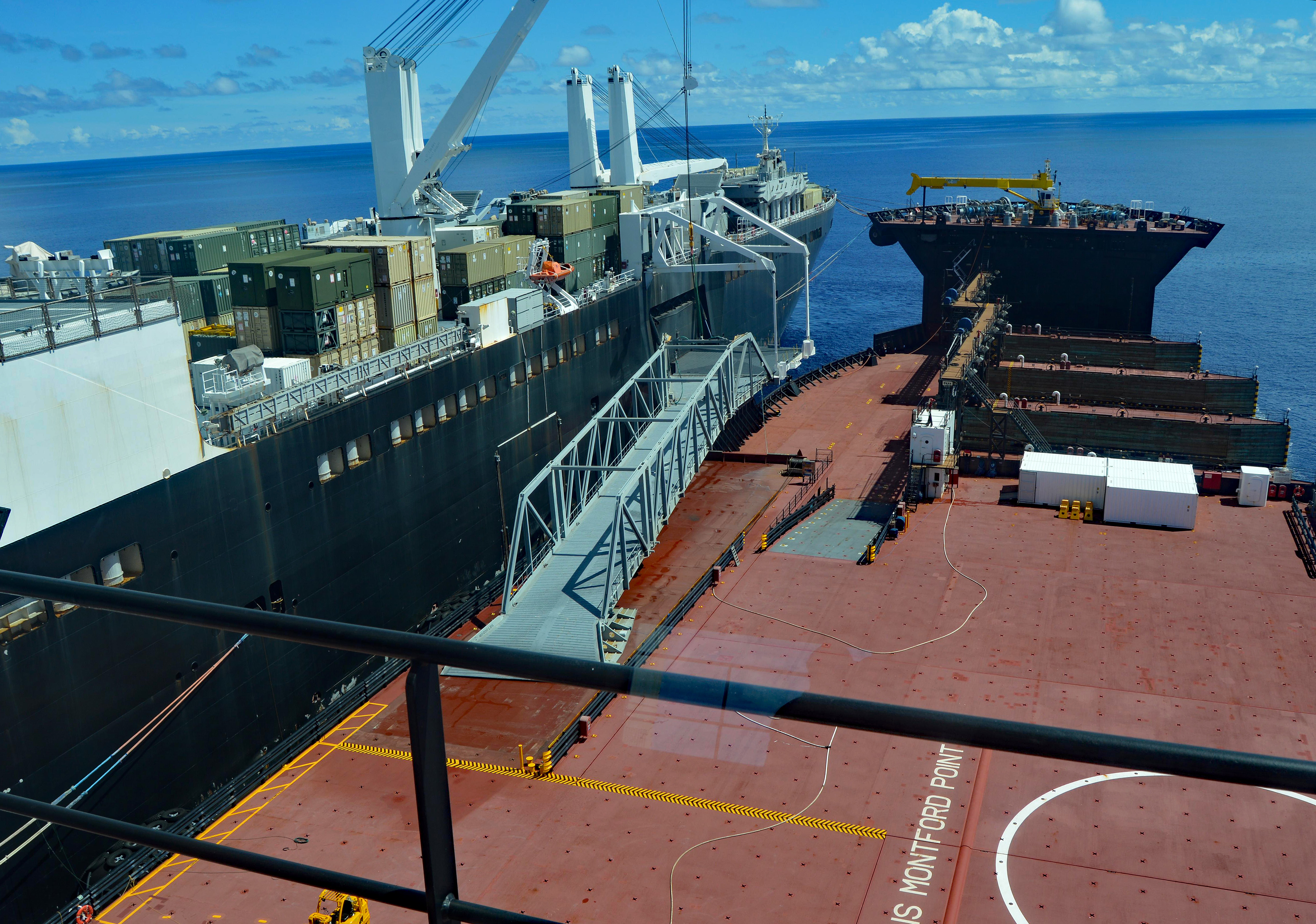The vehicle transfer ramp connects expeditionary transfer dock USNS Montford Point (T-ESD 1) and maritime prepositioning force ship USNS Dahl (T-AKR 312) during a maneuver to demonstrate MSC’s unique seabasing capabilities on July 21, 2016. US Navy photo.