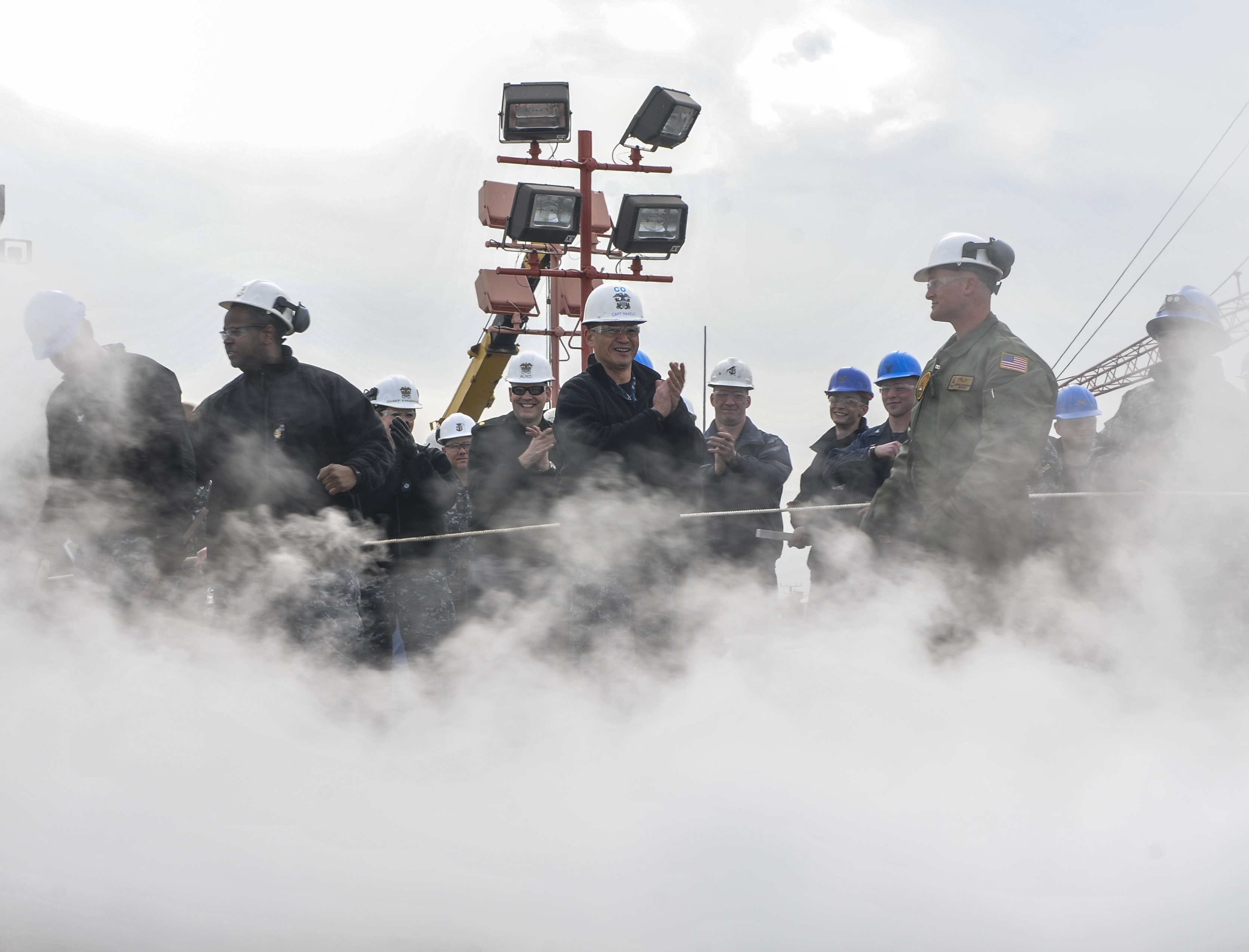 Capt. Ron Ravelo, Commanding Officer of Nimitz-class aircraft carrier USS Abraham Lincoln (CVN 72), cheers along with his Sailors after the successful testing of Lincoln’s catapult on the flight deck on Jan. 28, 2016. Lincoln is currently undergoing a Refueling and Complex Overhaul (RCOH) at Newport News Shipbuilding. US Navy photo.