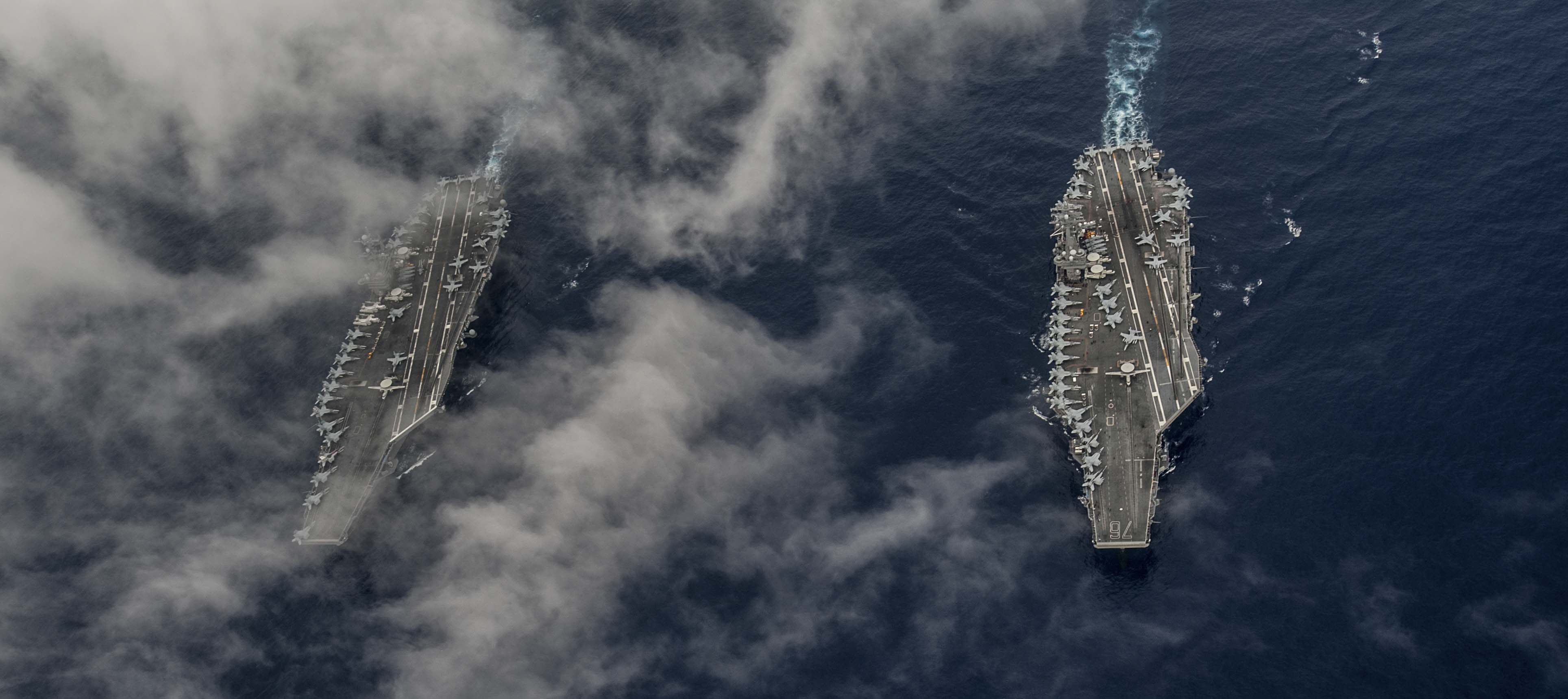 The Nimitz-class Aircraft carriers USS John C. Stennis (CVN 74) and USS Ronald Reagan (CVN 76) conduct dual aircraft carrier strike group operations in the U.S. 7th Fleet area of operations in support of security and stability in the Indo-Asia-Pacific. US Navy photo.