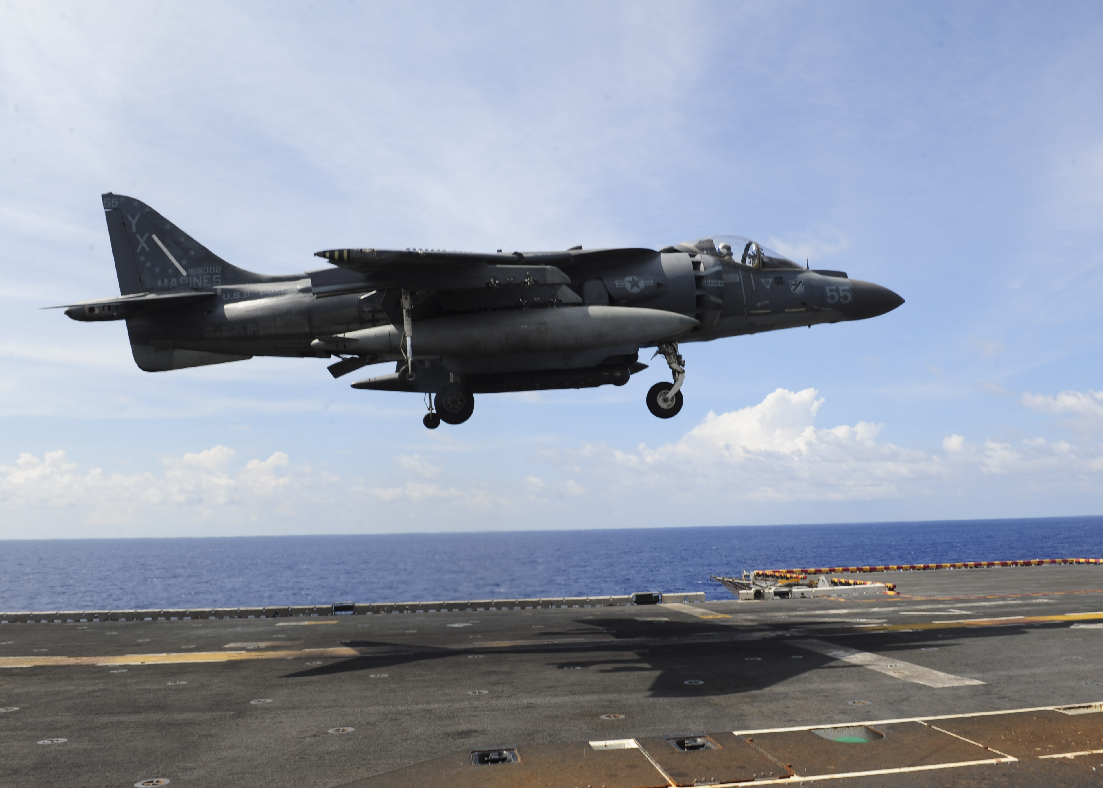An AV-8B Harrier II, assigned to the 13th Marine Expeditionary Unit (MEU), prepares to land on the flight deck of amphibious assault ship USS boxer (LHD-4). US Navy Photo