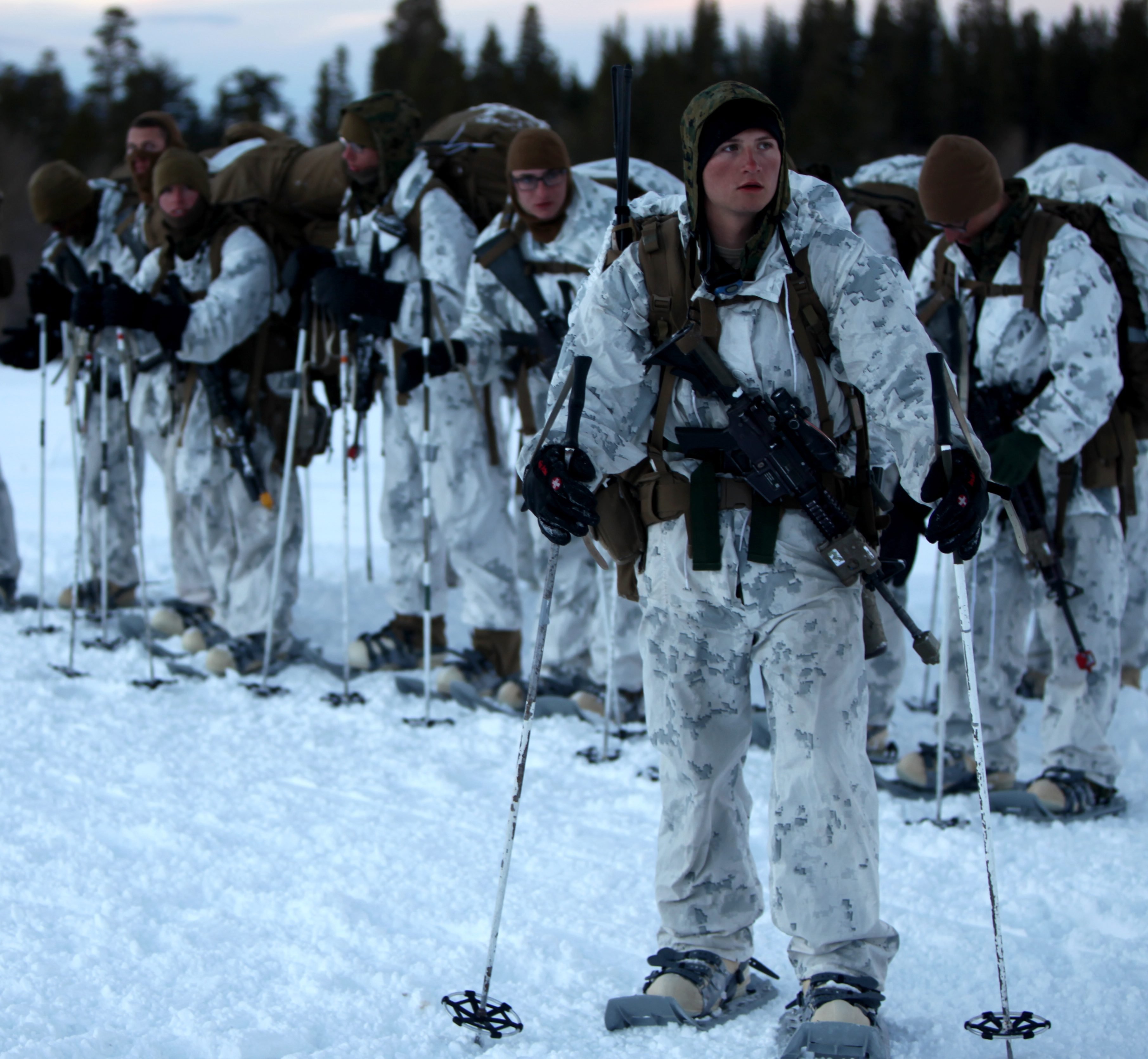 Marines check their gear before continuing a hike up in the Sierra Mountains during cold weather training at Marine Corps Mountain Warfare Training Center, Calif. on Jan. 21, 2016. US Marine Corps Photo