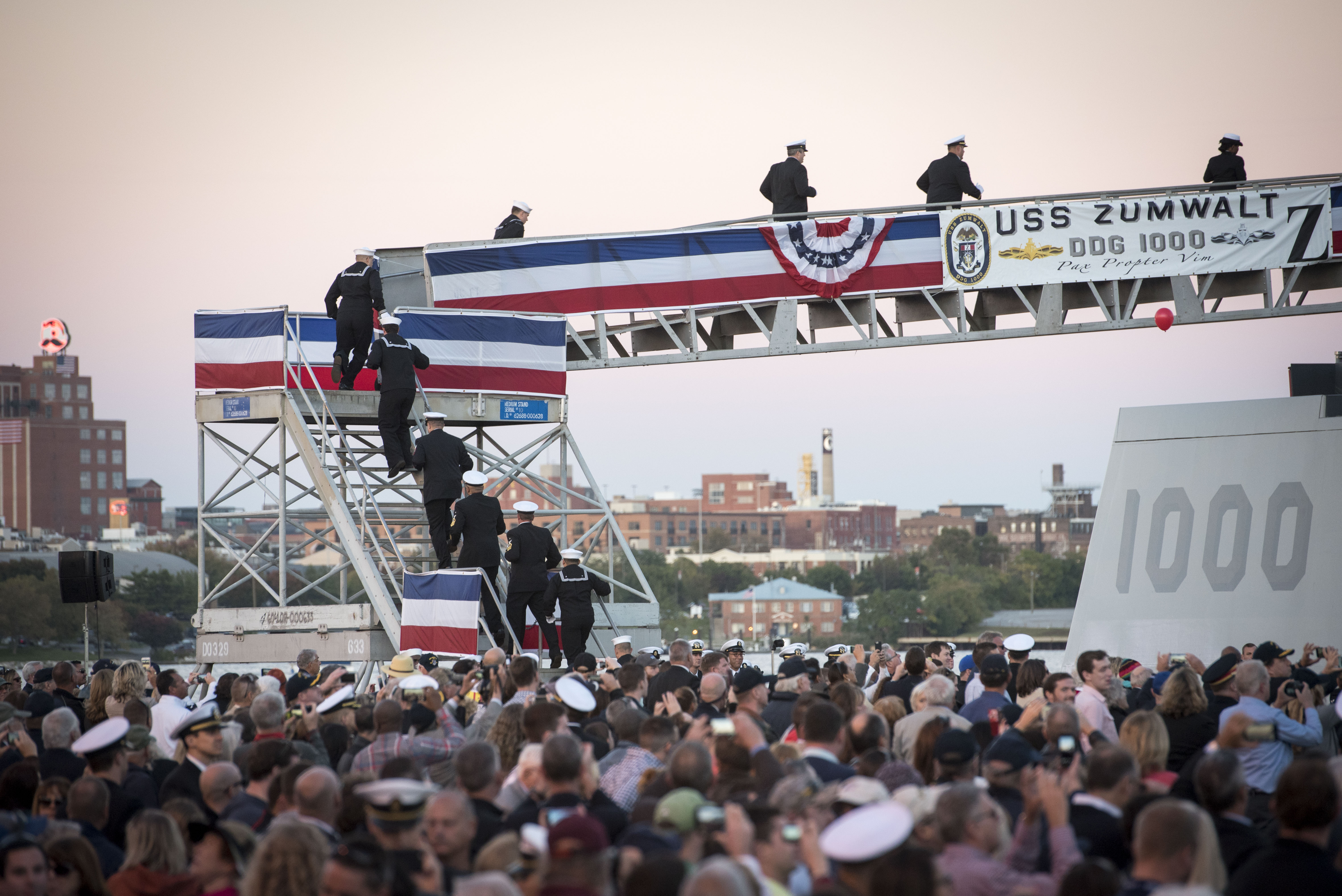 The crew of the Navy's newest and most technologically advanced warship, USS Zumwalt (DDG 1000), brings the ship to life during a commissioning ceremony at North Locust Point in Baltimore. US Navy photo.