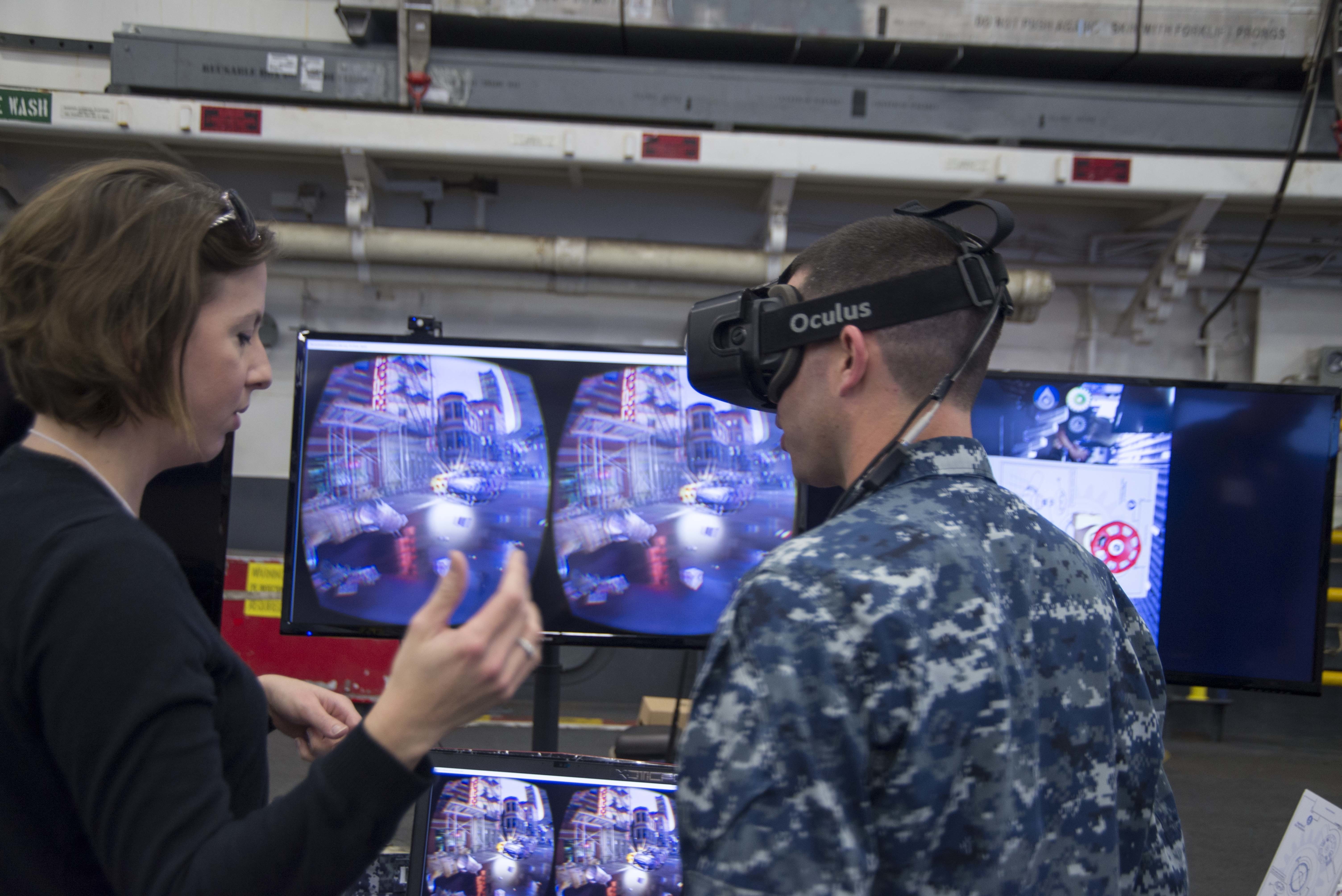 Lt. Stephen Gallagher tries a virtual reality headset at the Innovation Jam hosted aboard Wasp-class amphibious assault ship USS Essex (LHD 2) in March 2016. Commander, U.S. Pacific Fleet’s Bridge Program welcomes the Space and Naval Warfare Systems Center Pacific Innovation Jam, sponsored by OPNAV N4 Fleet Readiness and Logistics and the Office of Naval Research. The Innovation Jam showcases pioneering concepts and rapid solutions, and one of the bright ideas will be selected for initial funding, development, prototyping and possible transition to Fleet-wide implementation. US Navy photo.