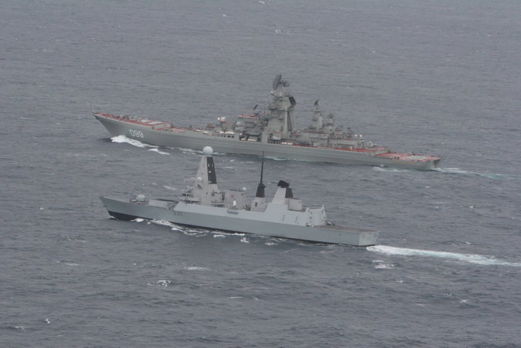 Royal Navy guided missile destroyer HMS Dragon (foreground) with the Russian Kirov Class battlecruiser 'Pyotr Velikiy' in 2014. UK MoD Photo