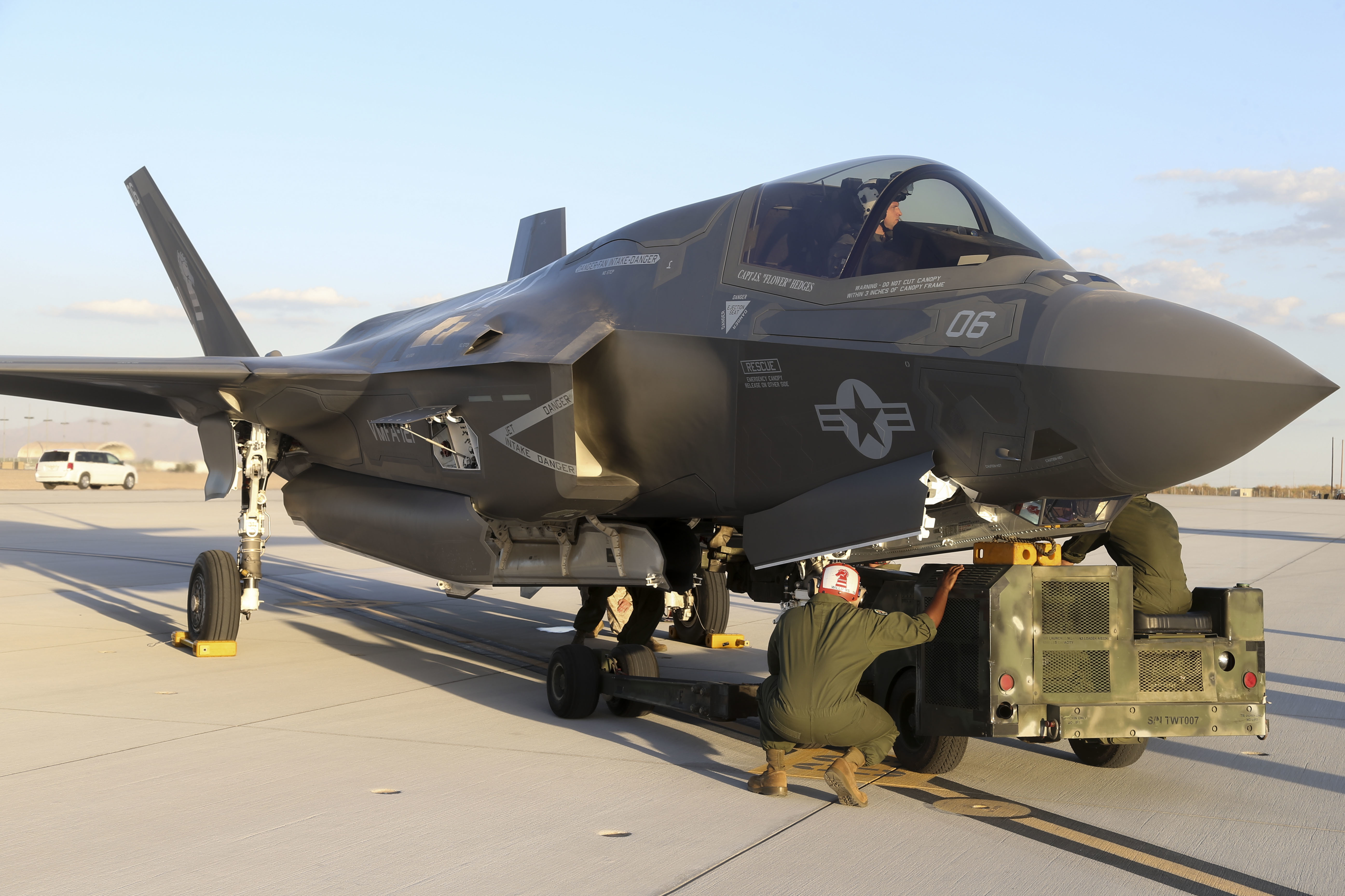 U.S. Marines with Marine Fighter Attack Squadron 121 (VMFA-121), 3rd Marine Aircraft Wing, conduct the first ever hot load on the F-35B Lightning II in support of Weapons and Tactics Instructor Course (WTI) 1-17 at Marine Corps Air Station Yuma, Ariz., Sept. 22, 2016. The exercise is part of WTI 1-17, a seven-week training event hosted by Marine Aviation Weapons and Tactics Squadron One (MAWTS-1) cadre. MAWTS-1 provides standardized tactical training and certification of unit instructor qualifications to support Marine Aviation Training and Readiness and assists in developing and employing aviation weapons and tactics. (U.S. Marine Corps photograph by SSgt. Artur Shvartsberg, MAWTS-1 COMCAM)