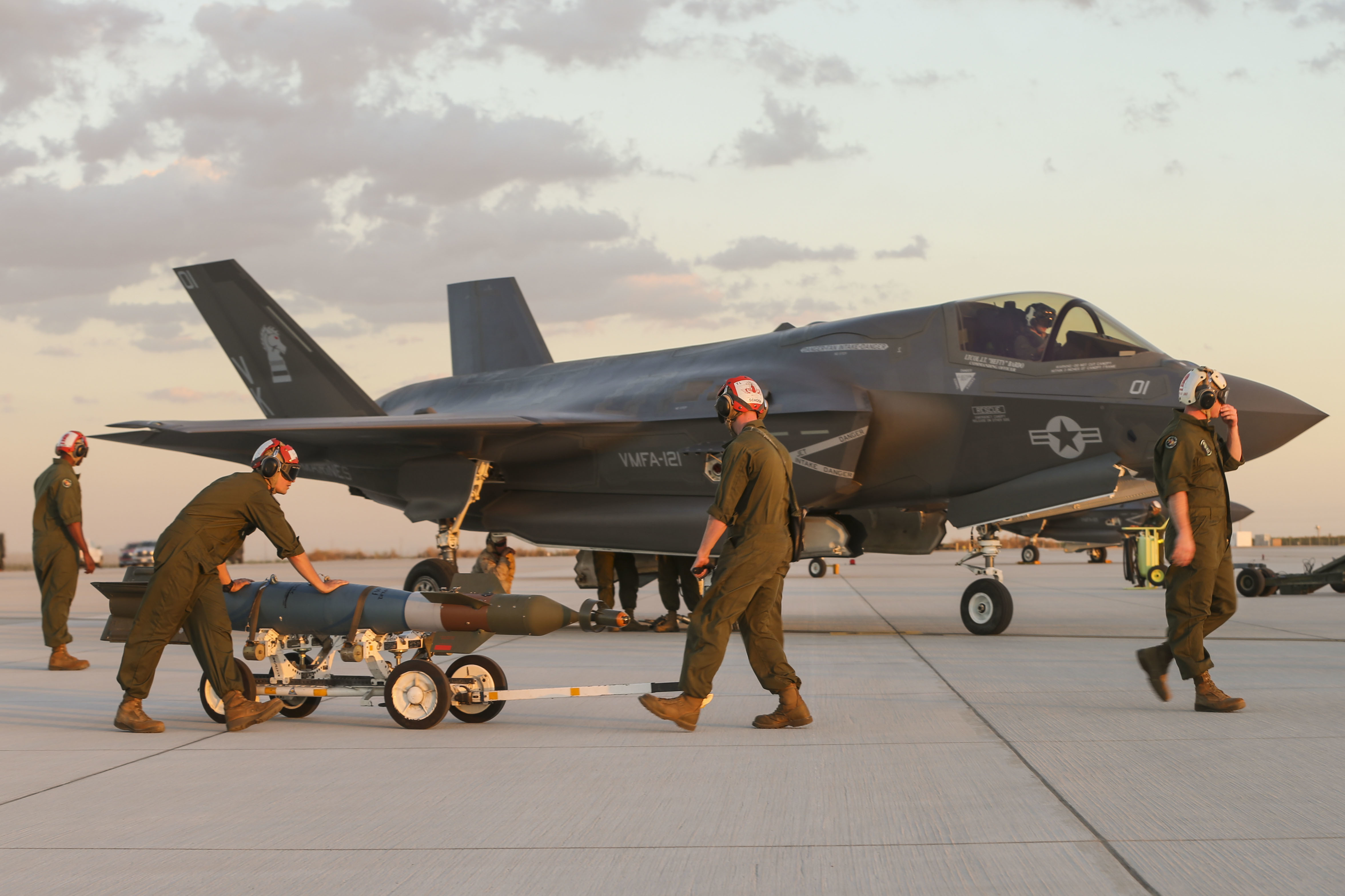 U.S. Marines with Marine Fighter Attack Squadron 121 (VMFA-121), 3rd Marine Aircraft Wing, conduct the first ever hot load on the F-35B Lightning II in support of Weapons and Tactics Instructor Course (WTI) 1-17 at Marine Corps Air Station Yuma, Ariz., Sept. 22, 2016. The exercise is part of WTI 1-17, a seven-week training event hosted by Marine Aviation Weapons and Tactics Squadron One (MAWTS-1) cadre. US Marine Corps photo.