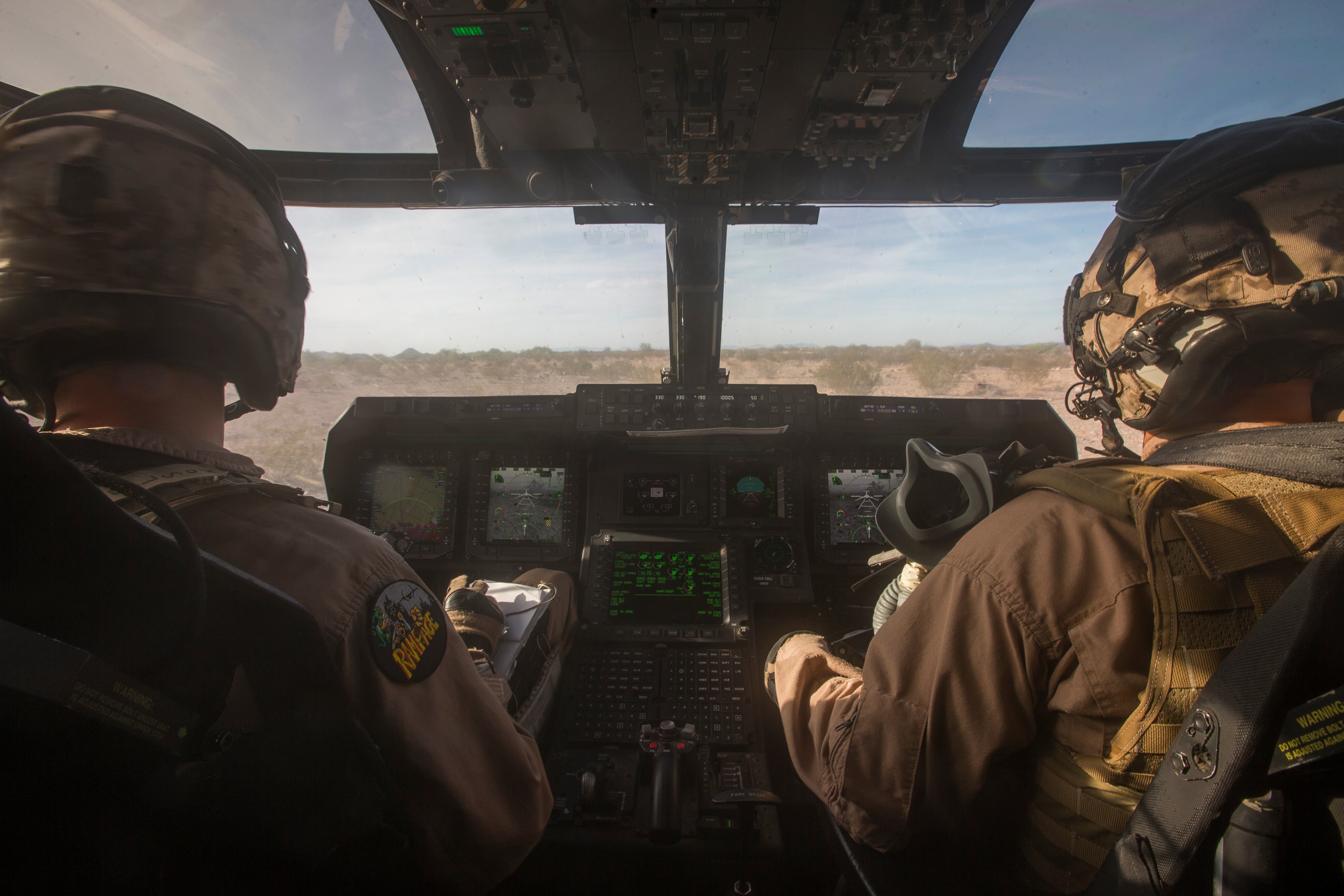 U.S. Marine Corps Maj. Eric Duchene, MV-22 instructor pilot, left, with Marine Aviation Weapons and Tactic Squadron One (MAWTS-1) and Capt. Austin Stobaugh MV-22 pilot with Marine Medium Tiltrotor Squadron (VMM) 262, 1st Marine Aircraft Wing (MAW) lift off in an MV-22B Osprey during a marine expeditionary unit exercise (MEUEX) at Yuma, Ariz., Oct. 7, 2016. MEUEX was part of Weapons and Tactics Instructors course (WTI) 1-17, a seven week training event hosted by MAWTS-1 cadre. MAWTS-1 provides standardized tactical training and certification of unit instructor qualifications to support Marine Aviation Training and Readiness and assists in developing and employing aviation weapons and tactics. (U.S. Marine Corps photo by Cpl. AaronJames Vinculado, MAWTS-1)