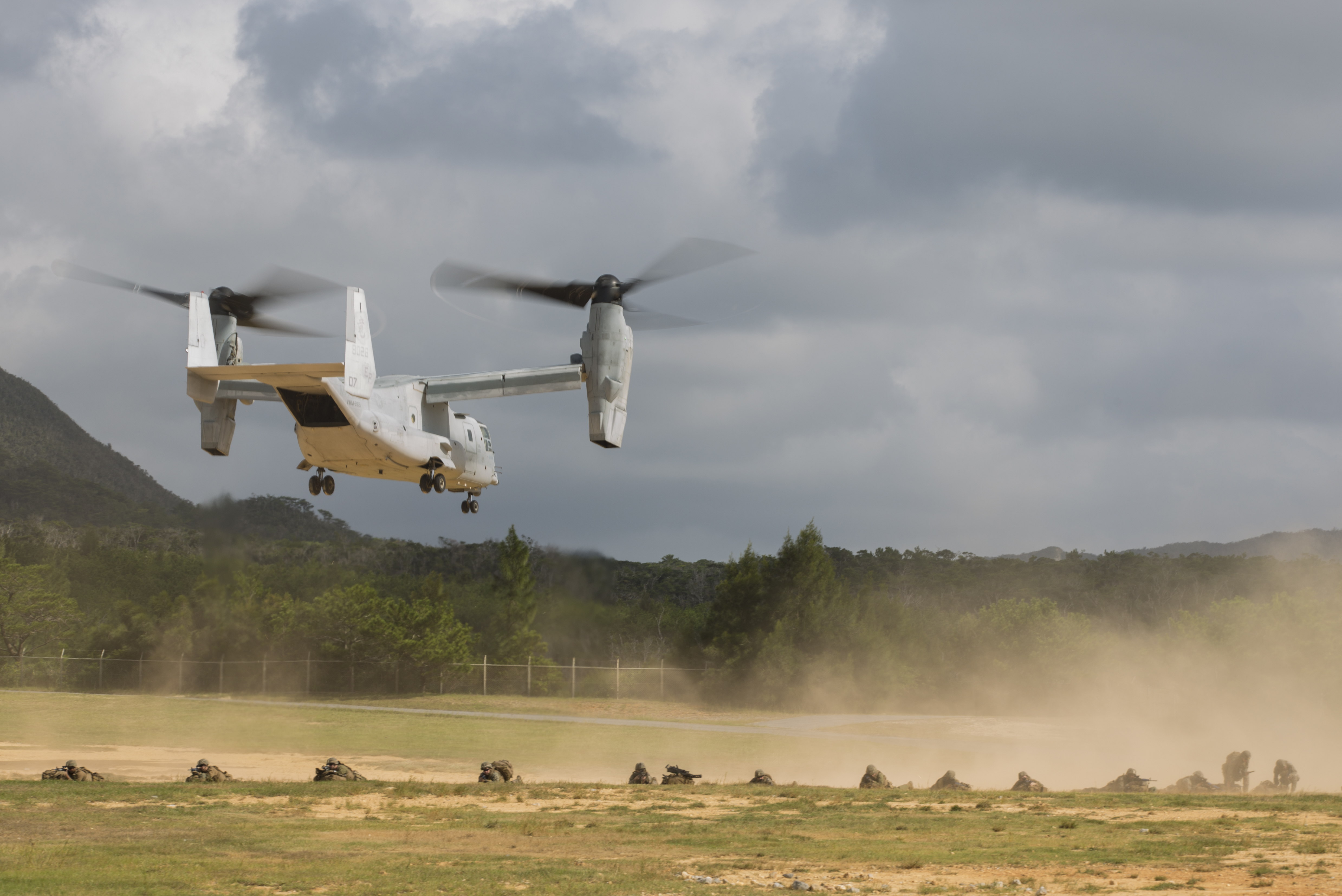 U.S. Marines assigned with 3rd Battalion, 3rd Marine Regiment, which is forward deployed from Kaneohe Bay, Hawaii provide security as an MV-22B Osprey tiltrotor aircraft from Marine Medium Tiltrotor Squadron 265, Marine Aircraft Group 36, 1st Marine Aircraft Wing, flies overhead during an air assault drill as part of Blue Chromite 2017, Okinawa, Japan, November 1, 2016. Blue Chromite is a U.S. – only exercise which strengthens the Navy-Marine Corps expeditionary, amphibious rapid-response capabilities based in Okinawa and the greater Indo-Asia-Pacific region. (U.S. Marine Corps photo by MCIPAC Combat Camera Lance Cpl. Tiana Boyd)