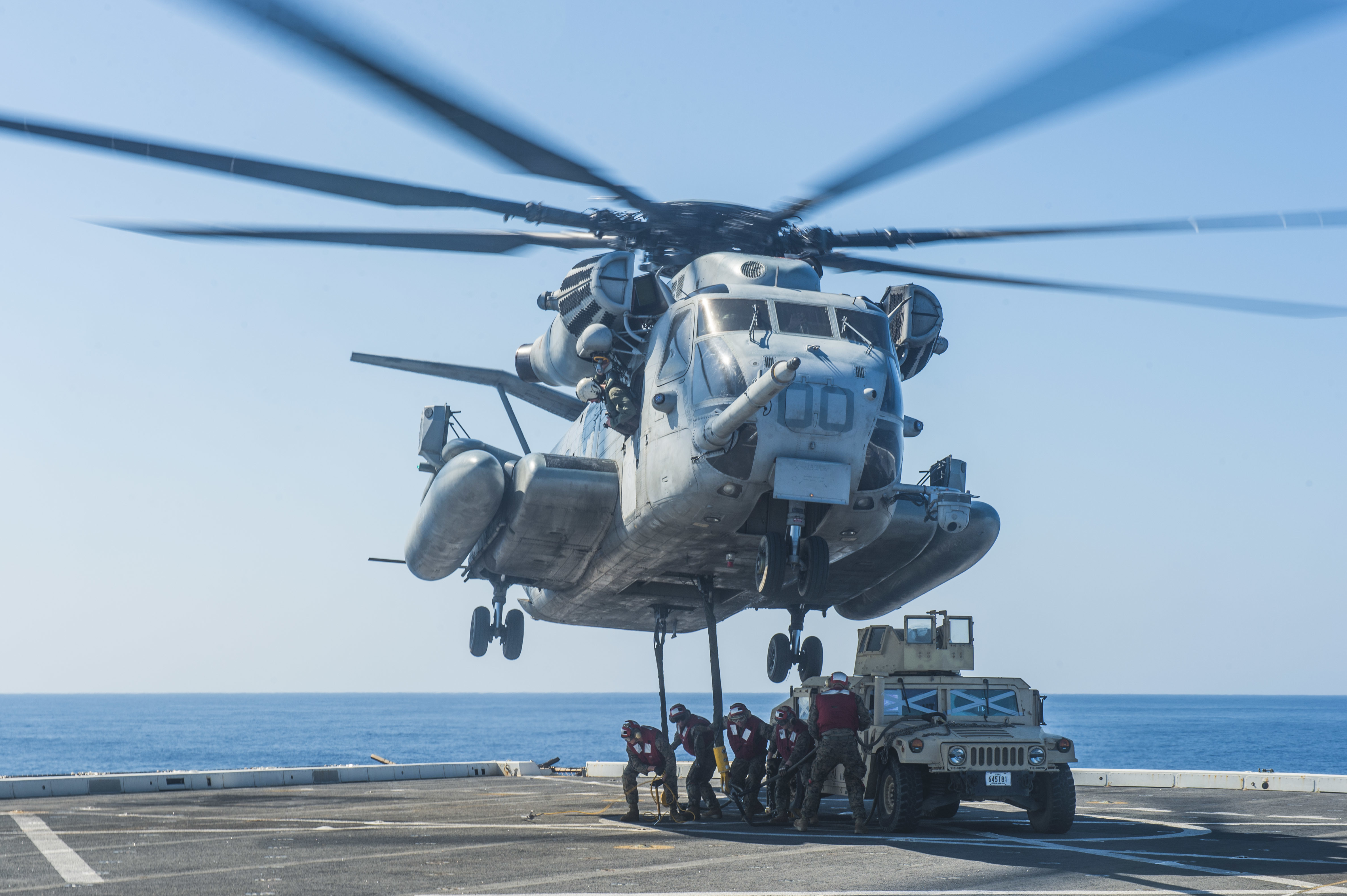 161031-N-XM324-095 WATERS OUTSIDE OKINAWA (Oct. 31, 2016) Marines, assigned to 3rd Battalion, 3rd Marine Regiment, attach a Humvee to a CH-53E Super Stallion helicopter, assigned to the 1st Marine Aircraft Wing, from the flight deck of the amphibious transport dock ship USS Green Bay (LPD 20) during Blue Chromite. Blue Chromite is a U.S.-only exercise, which strengthens the Navy-Marine Corps expeditionary, amphibious rapid-response capabilities based in Okinawa, Japan and the greater Indo-Asia-Pacific region. (U.S. Navy photo by Petty Officer 3rd Class Patrick Dionne/Released)