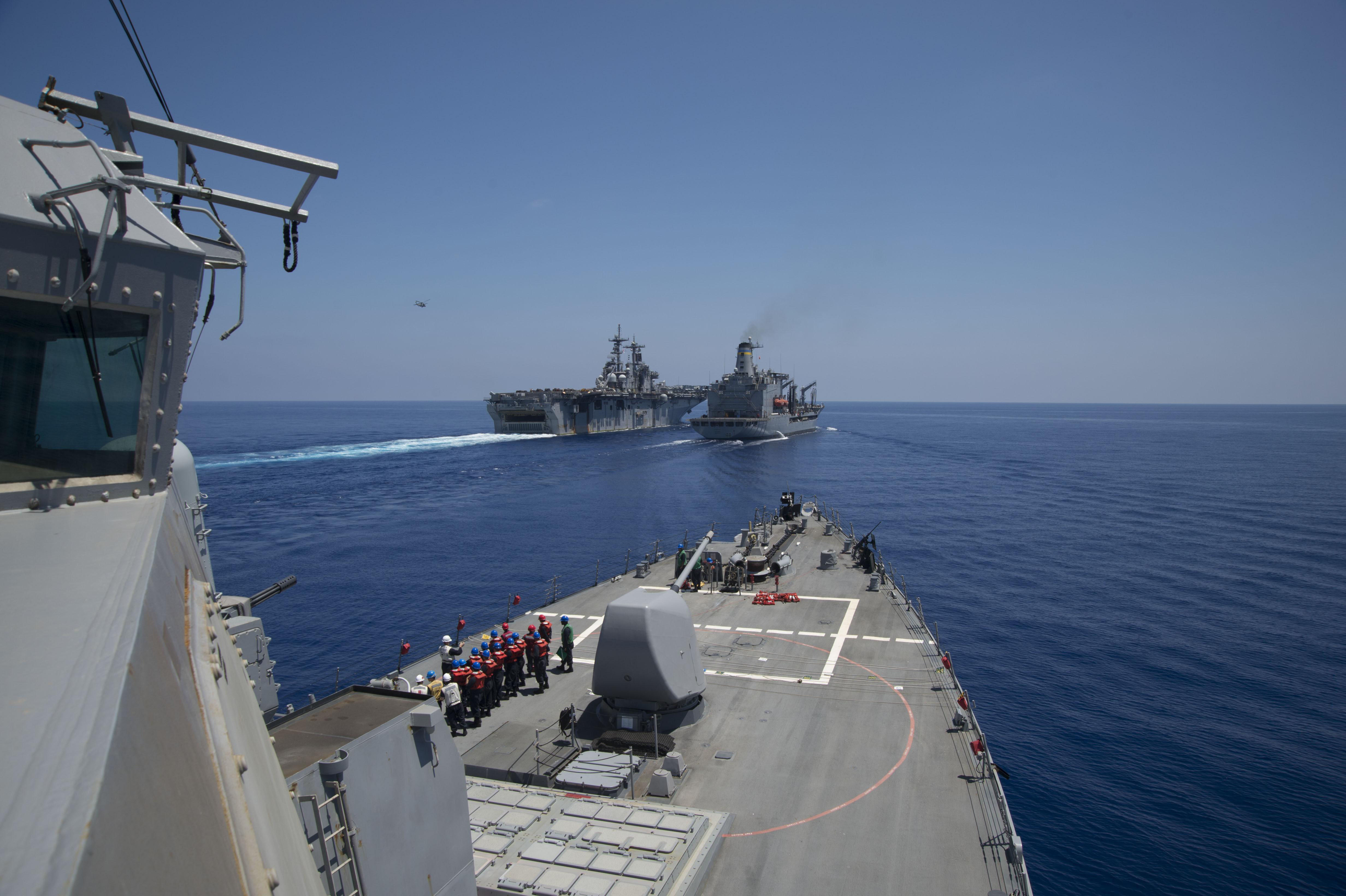 USS Carney (DDG 64) approaches the Military Sealift Command fleet replenishment oiler USNS Big Horn (T-AO-198) and USS Wasp (LHD 1) during a replenishment-at-sea in the Mediterranean Sea on Aug. 6, 2016. US Navy photo.