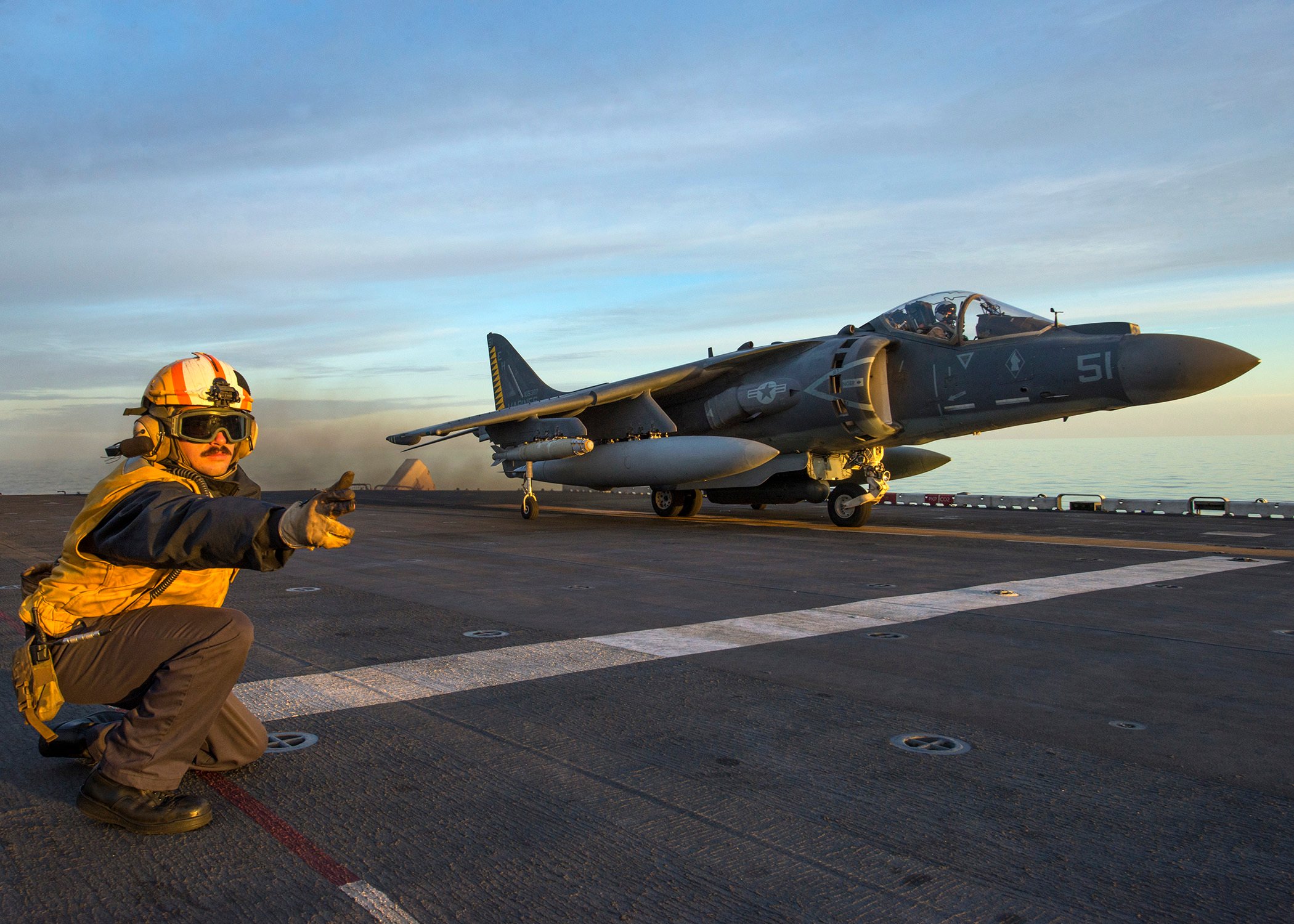 An AV-8B Harrier, from the 22nd Marine Expeditionary Unit (MEU), takes off from the amphibious assault ship USS Wasp (LHD 1) on Dec. 5, 2016. The 22nd MEU, embarked on Wasp, is conducting precision air strikes in support of the Libyan Government aligned forces against Daesh targets in Sirte, Libya, as part of Operation Odyssey Lightning. US Navy photo.