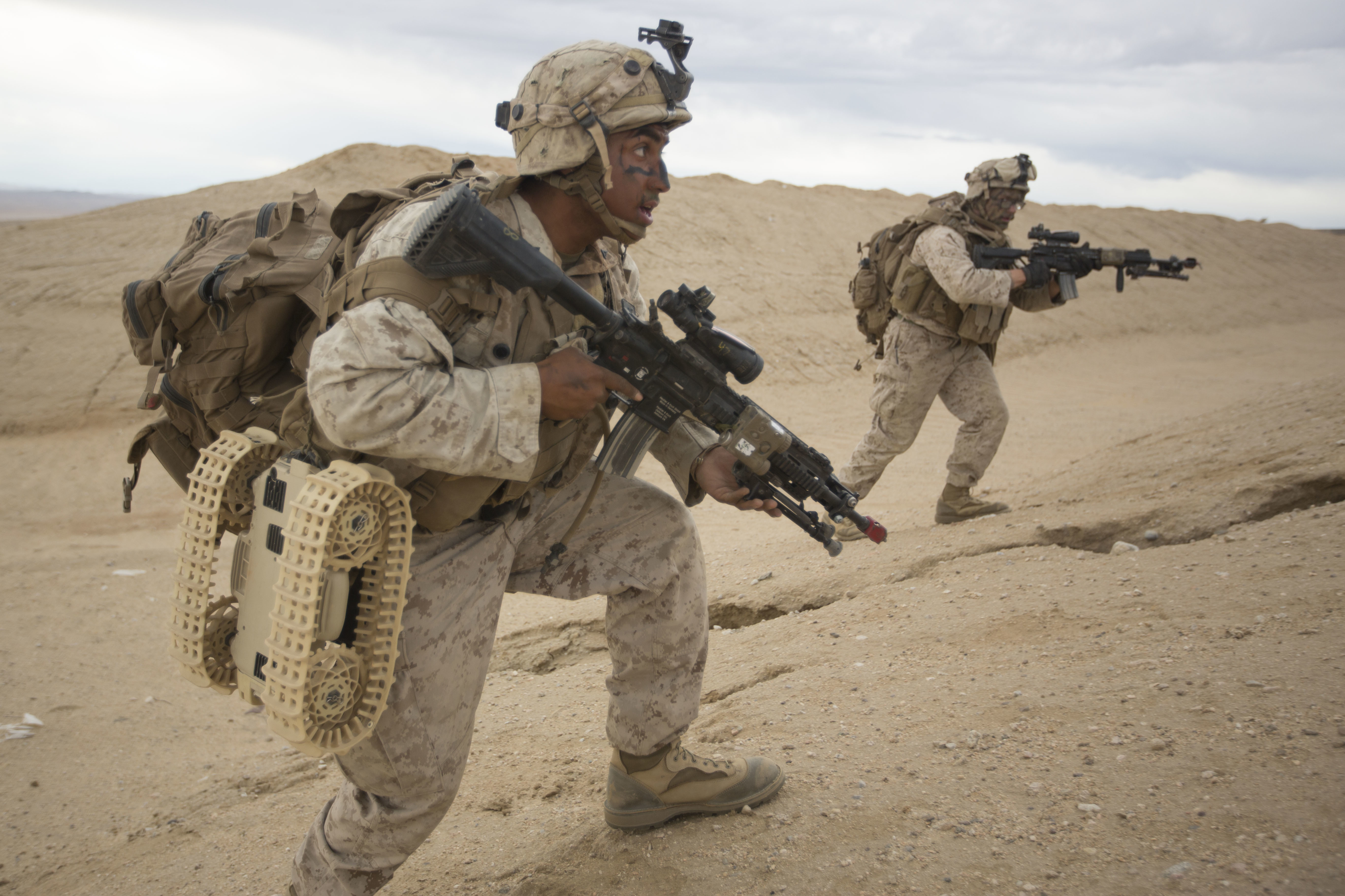 United States Marine Corps Lance Cpl Antonio Marin, 3rd Battalion, 5th Marine Regiment, India Company, moves to the side a hill to deploy an unmanned Dragonrider drone in a hostile mountain town in Marine Corps Air Ground Combat Center 29 Palms, Calif. Oct 23, 2016. Marines of 3/5 are currently field testing equipment and technology from the Marine Corps War Fighting Lab during Integrated Training Exercise 1-17 in order to enhance and sustain combined arms proficiency in preparation for their deployment as the Ground Combat Element for the 31st Marine Expeditionary Unit. (United States Marine Corps photo by Lance Cpl Samuel Brusseau.)