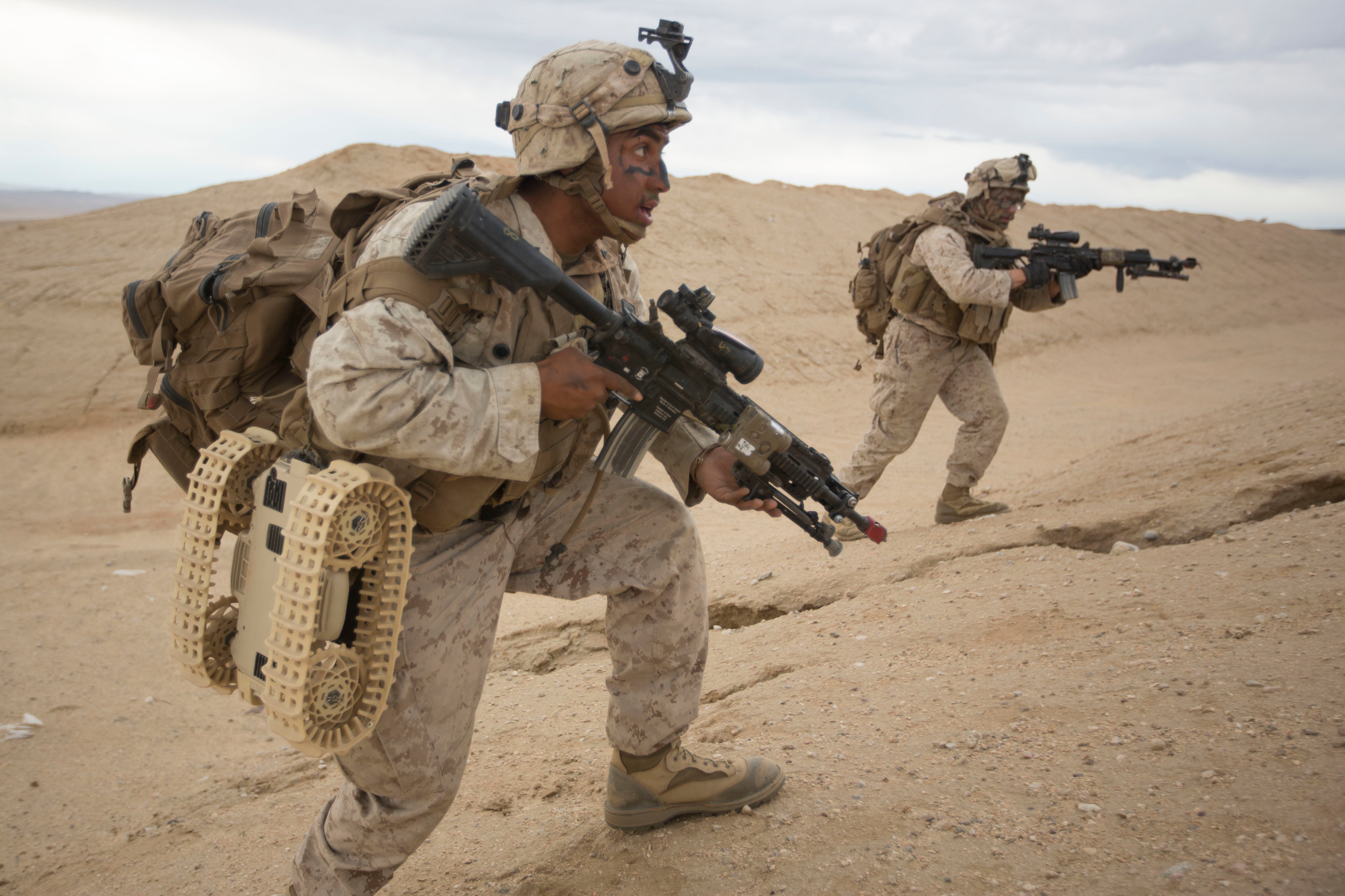 United States Marine Corps Lance Cpl Antonio Marin, 3rd Battalion, 5th Marine Regiment, India Company, moves to the side a hill to deploy an unmanned Dragonrider drone in a hostile mountain town in Marine Corps Air Ground Combat Center 29 Palms, Calif. Oct 23, 2016. Marines of 3/5 are currently field testing equipment and technology from the Marine Corps War Fighting Lab during Integrated Training Exercise 1-17 in order to enhance and sustain combined arms proficiency in preparation for their deployment as the Ground Combat Element for the 31st Marine Expeditionary Unit. (United States Marine Corps photo by Lance Cpl Samuel Brusseau.)